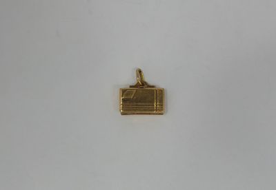 a close up of a gold plated metal object on a white surface