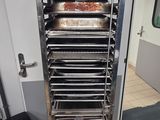 an image of a commercial kitchen with a rack of food