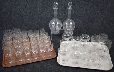 a tray of wine glasses and a decanter on a table
