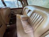 a seat in the back of a car with a box on it