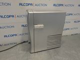 an image of a silver refrigerator sitting on top of a counter
