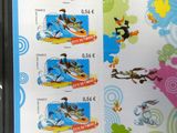 a sheet of stamps with a picture of cartoon characters on it