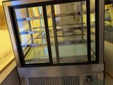 an image of a commercial refrigerator in a kitchen