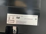 an image of a black printer with a white label on it