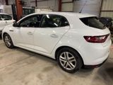 a picture of a white car parked in a garage