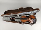 a violin in a case with a bow in it