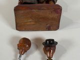 a wooden box with a bottle opener and a bottle opener on it
