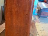 a wooden table with a clock on top of it