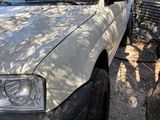 a truck that is parked in the shade of a tree