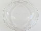 a glass bowl with a lid on a white surface