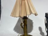 two lamps that are sitting next to each other on a table