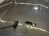 a close up of a car ' s windshield with a brush on it