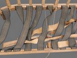 an image of a chair made out of wood and fabric