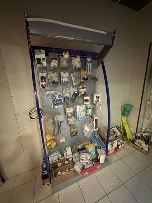 a display case with many items on it in a room