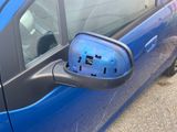 a blue car with a power outlet on the side of it