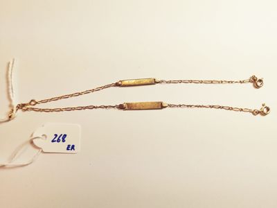 a close up of a necklace with a tag attached to it