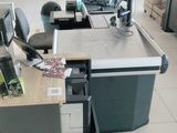 an image of a store with a lot of desks and computers