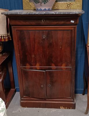 a wooden cabinet with a marble top and a vase on top of it