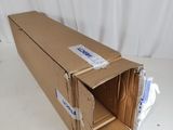 an open cardboard box sitting on top of a white table
