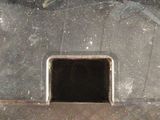 an image of a manhole with a hole in it