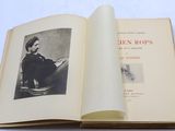 an open book with a picture of a man sitting on a chair
