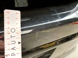 a measuring tape on the front of a car