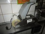 a machine that has a roll of tape on top of it