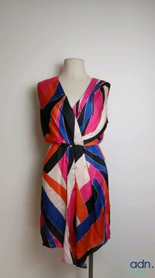 an image of a colorful dress on a mannequin stand