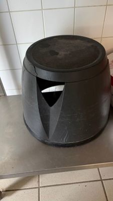 an image of a trash can sitting on a kitchen counter