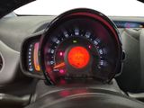 a close up of a car dashboard with a speedometer