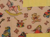 a brown bag with a pattern of children ' s toys on it