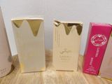 several different types of perfumes are lined up on a table