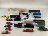 a lot of toy trains and trucks on the table