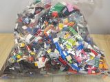 a bag full of legos sitting on a table