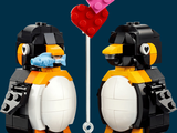 two lego penguins that are standing next to each other