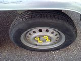 a close up of a tire on the side of a truck