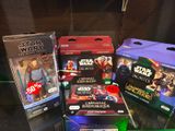 several star wars action figures are on display in a glass case