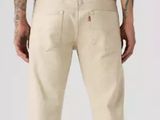the back of a man in a black t - shirt and khaki pants