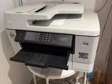 a printer that is sitting on top of a table