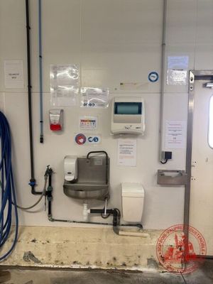 a picture of a room with a sink and a hose