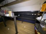 a room that has a bunch of items on the shelves