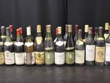 several bottles of wine are lined up on a table