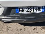 the rear end of a car with a license plate on it ' s bumper