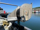 a boat that is sitting in the water near a dock