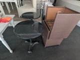 tables and chairs in a room with a television on the wall