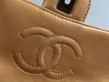 the inside of a chanel bag with a small logo on it