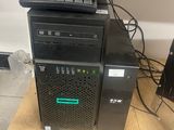 a computer tower that has a mouse on top of it
