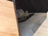 a mirror on a table with a plate of food on it