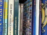 many books that are on a shelf in the room