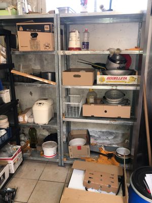 many boxes and containers on the shelves in the kitchen